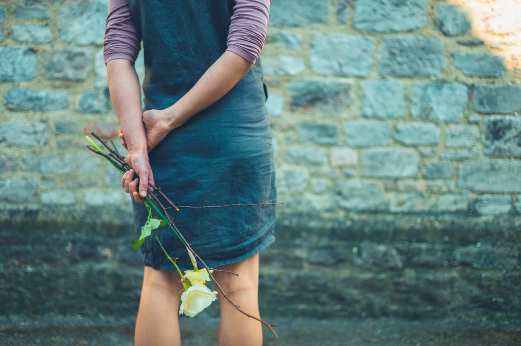 A,Young,Woman,Is,Standing,Near,A,Stone,Wall, funeral, humanist,