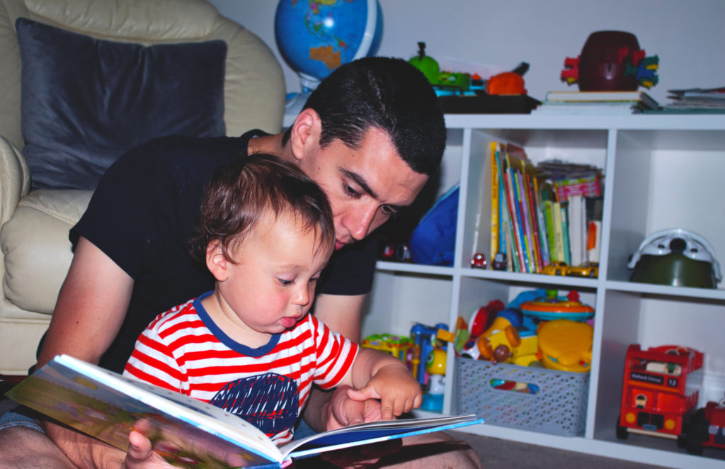 dad sitting with child thinking about writing a will